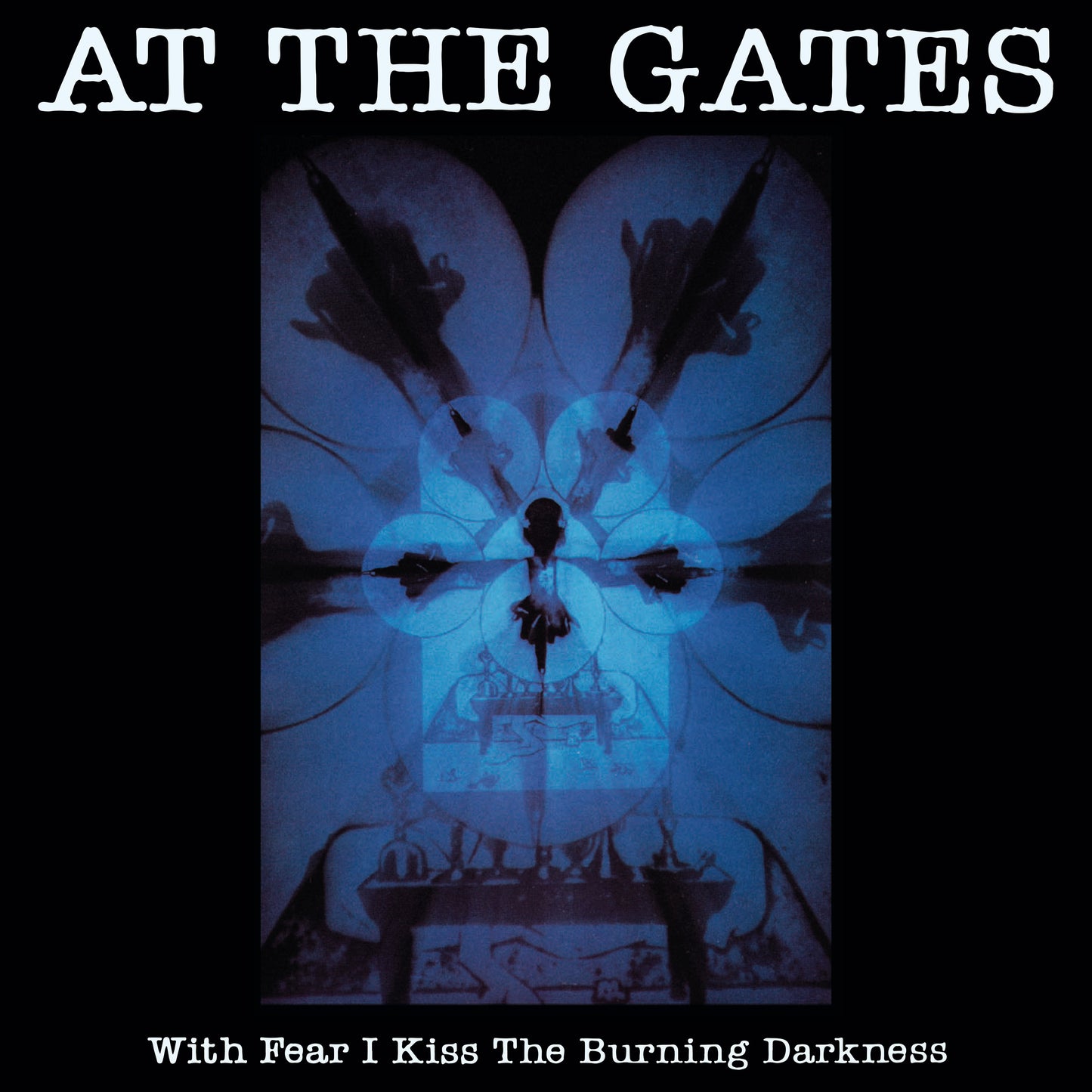 Album cover for With Fear I Kiss The Burning Darkness by At The Gates features a dark, abstract blue-toned design with symmetrical shapes, a central silhouette, and bold white text displaying the band and album title. Brand: At The Gates.