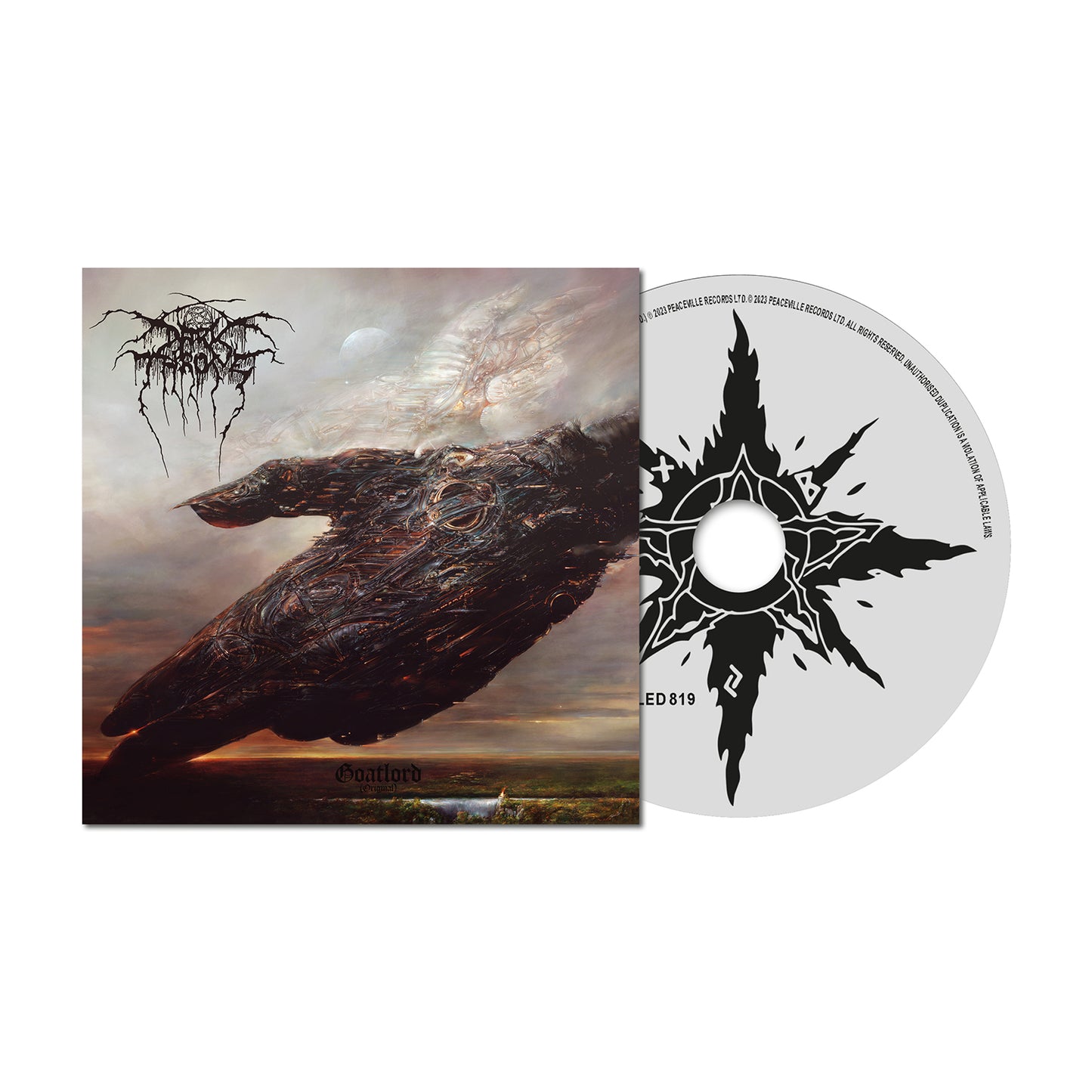 A Darkthrone CD and case featuring dark, surreal artwork of a blackened hand-like form in a cloudy sky. The CD displays a black starburst design with stylized text on a gray background.
