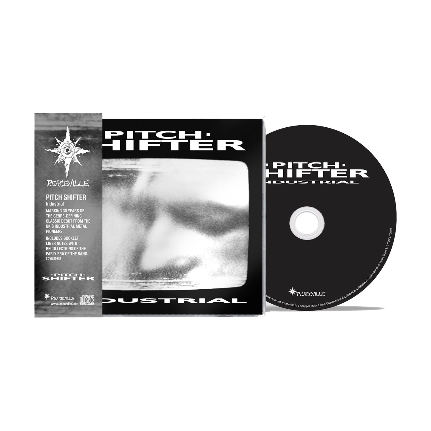 A CD case and disc for PITCHSHIFTER’s remastered debut, Industrial, featuring a blurry black-and-white face on the cover with bold white band text. Includes an informational insert on the left side.