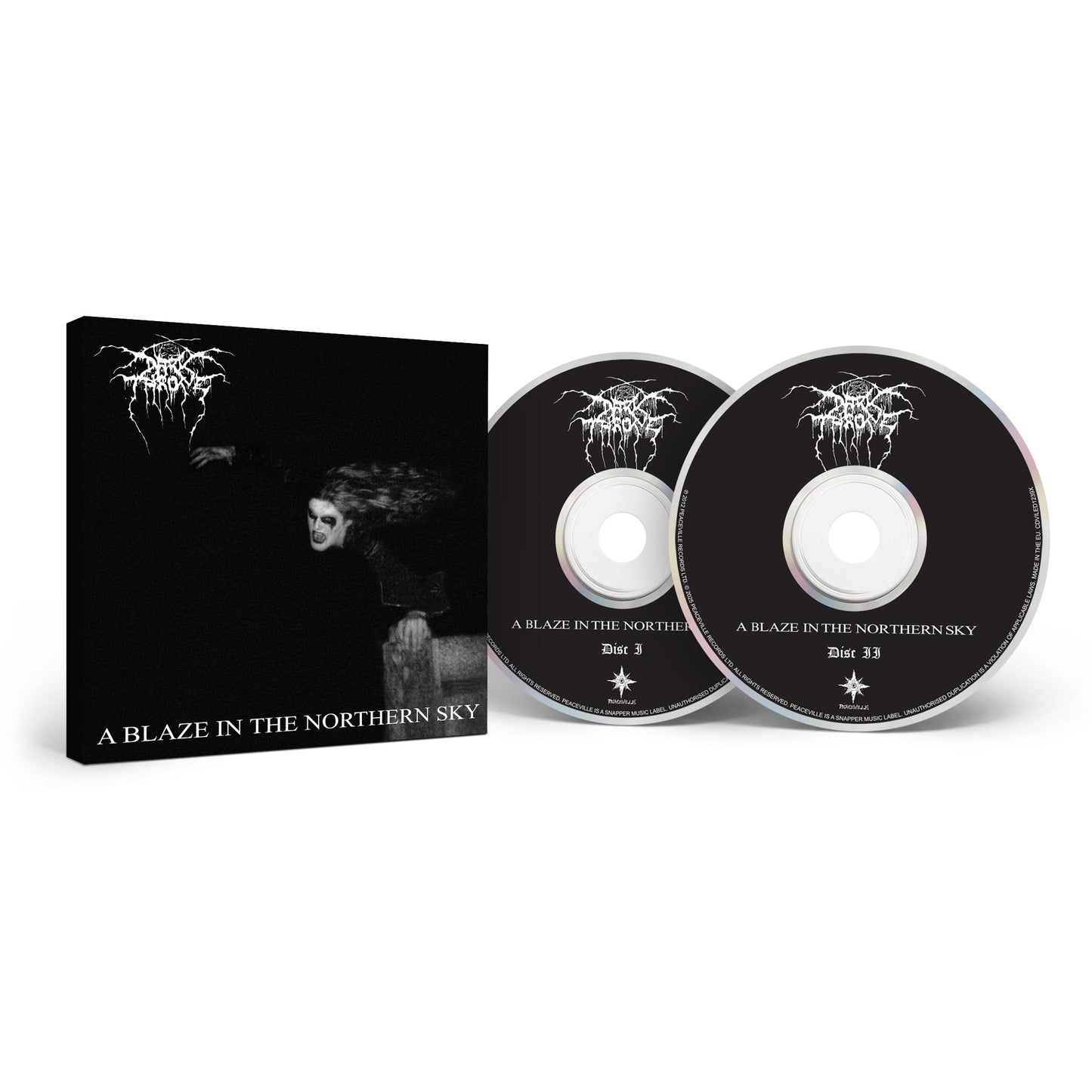 Darkthrone box set of A Blaze In The Northern Sky—Norwegian Black Metal classic—inclusive of two black CDs with white text, housed in a box featuring a dark, ghostly cover image and the album title.