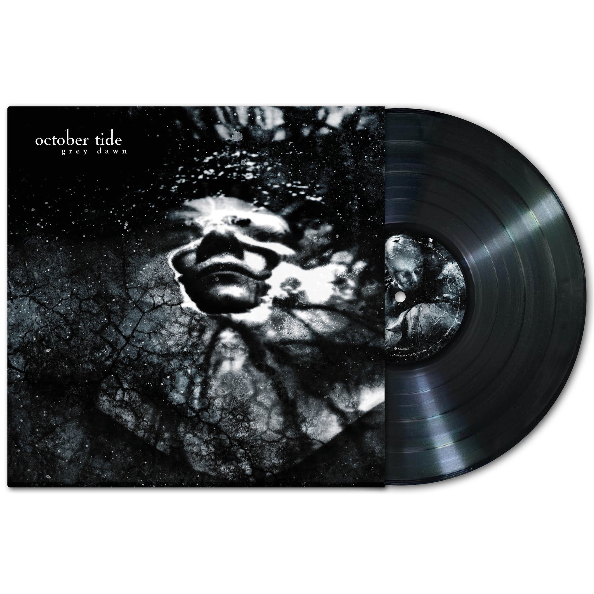 A vinyl record partly out of its sleeve displays October Tide’s Grey Dawn album: dark, abstract artwork showing a face in a cracked, cloudy backdrop, reflecting doom metal's stark black-and-white aesthetic.
